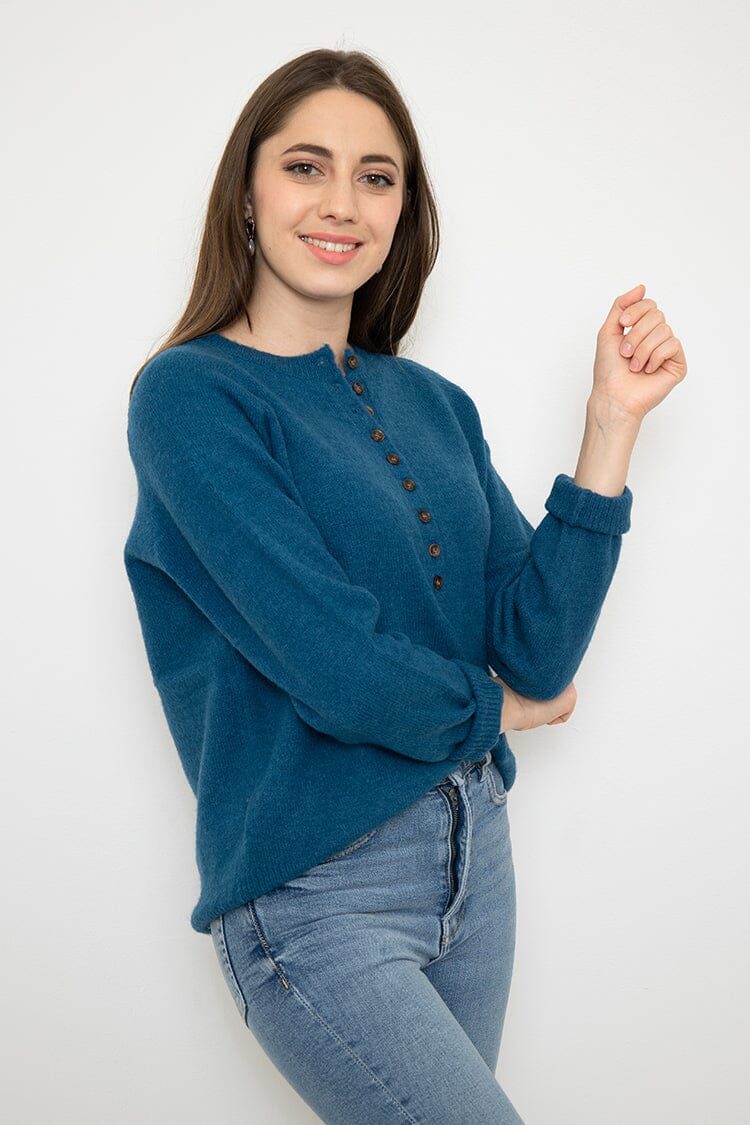 Pull avec bouton pull